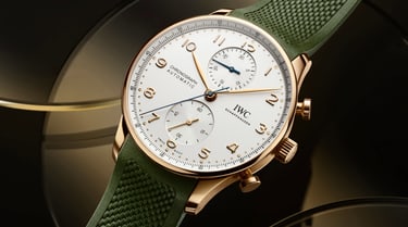The IWC IW371611 with gold case and green rubber strap