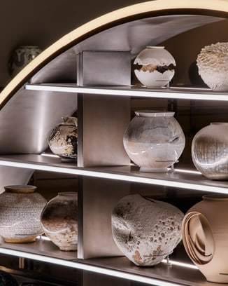 A shelf featuring various kinds of moon jars.
