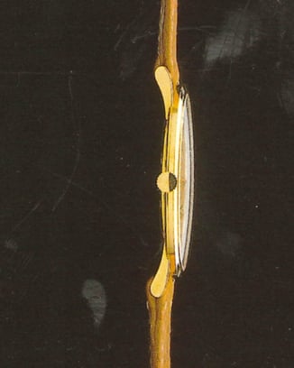 IWC 2008 Ultra-thin Portofino Hand Wound sideshot with white dial, yellow gold case and taupe strap