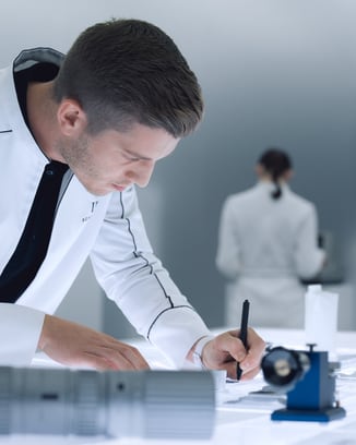 An Engineers Society member examining their work with precision.