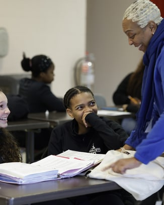Participants of a Laureus Academy event holding hands together