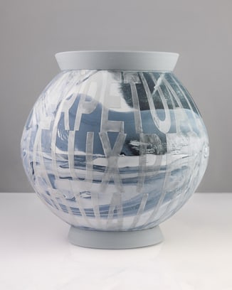 Moon jar with an abstract, marble-like pattern in muted beige, orange and gray tones