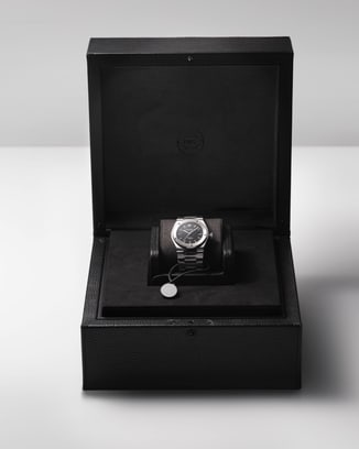 IWC black watchbox showcasing the Ingenieur SL watch against white background.