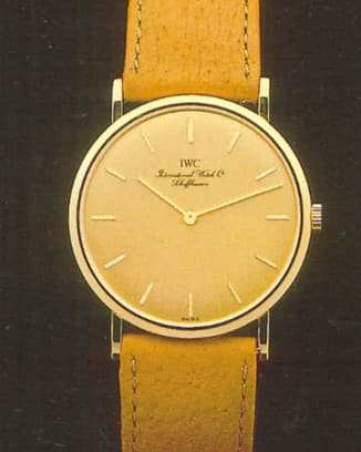 IWC 2008 Ultra-thin Portofino Hand Wound with white dial, yellow gold case and taupe strap