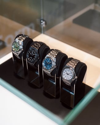 Display case featuring a row of IWC Ingenieur Automatic 40 watches with various dial colors.