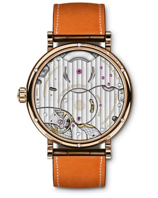 IW516403 Portofino Hand-Wound Moon Phase backshot of watch mechanism with 18 ct 5N gold Case and brown leather strap