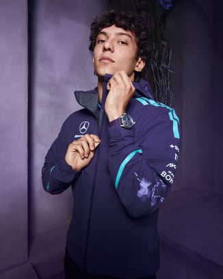 Kimi Antonelli wearing Petronas Team jacket and Pilot's Watch Chronograph 41 Mercedes-AMG Petronas Formula One™ Team watch.