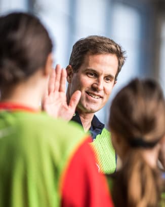 IWC CEO Chris Grainger-Herr with kids at a Laureus Academy event