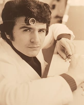 26-year-old Amaro Abad in watchmaker´s uniform working with watch