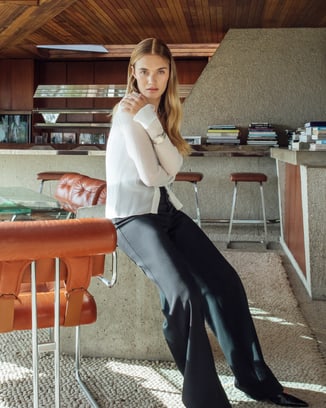 Female model wearing an Ingenieur sports watch with diamonds inside the Goldstein Residence.