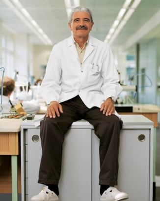 Amaro Amad in watchmaker`s uniform sitting on a desk at IWC headquarters